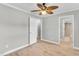 A spacious empty bedroom with neutral walls, and a view of the bathroom at 308 Lynn Road, Durham, NC 27703