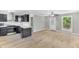 Open kitchen and living area with sleek appliances, bar seating, and ample counter space at 308 Lynn Road, Durham, NC 27703