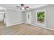 Inviting living room with natural light, neutral walls, and views of the landscaped yard at 308 Lynn Road, Durham, NC 27703