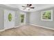 Cozy living room with updated windows, tile flooring, and natural light at 308 Lynn Road, Durham, NC 27703