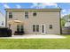 Back exterior features a patio with seating area, an outdoor grill, and backyard access at 3169 Diana Cir, Burlington, NC 27215