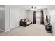Relaxing bedroom featuring comfortable sofa, TV, and plenty of natural light at 3169 Diana Cir, Burlington, NC 27215