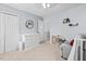 Bright bedroom showcasing neutral carpet, complemented by white dresser and a comfortable gray chair at 3169 Diana Cir, Burlington, NC 27215