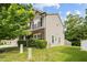 Well-manicured lawn surrounds this home with stone accents and tan siding at 3169 Diana Cir, Burlington, NC 27215