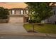 Charming two-story home featuring a well-manicured lawn, mature tree, and attached two-car garage at 3169 Diana Cir, Burlington, NC 27215