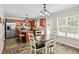 Eat-in kitchen featuring an island, stainless steel appliances, lots of counter space, and pendant lighting at 3169 Diana Cir, Burlington, NC 27215