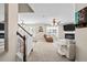 Open-concept living room with lots of seating, natural light, and a cozy fireplace at 3169 Diana Cir, Burlington, NC 27215