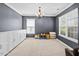 Versatile room featuring neutral color palette, built-in storage, and natural light from windows at 3169 Diana Cir, Burlington, NC 27215