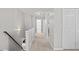 Upstairs hallway with carpet and doors to bedrooms and bathrooms at 3169 Diana Cir, Burlington, NC 27215