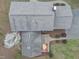 Aerial view of a home with a deck and an adjacent patio with red chairs at 3418 Carriage Trl, Hillsborough, NC 27278
