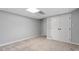 Basement featuring neutral walls, carpet, and closet with folding doors at 3418 Carriage Trl, Hillsborough, NC 27278