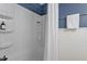 Bathroom tub and shower with white tile surround and white shower curtain at 3418 Carriage Trl, Hillsborough, NC 27278