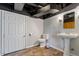 Basement bathroom with toilet, sink and a waterproof floor at 3418 Carriage Trl, Hillsborough, NC 27278