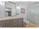 Bathroom featuring gray vanity with marble countertop and shower with glass doors at 3418 Carriage Trl, Hillsborough, NC 27278