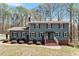 Charming two-story home with a brick staircase and manicured landscaping at 3418 Carriage Trl, Hillsborough, NC 27278