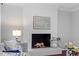 The living room features a painted brick fireplace with decorative accents, creating a cozy and inviting atmosphere at 3418 Carriage Trl, Hillsborough, NC 27278