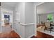 Hallway entrance to a dining room, featuring gray walls and white trim at 3418 Carriage Trl, Hillsborough, NC 27278