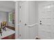 Neutral hallway with hardwood floors featuring a front door and access to other rooms at 3418 Carriage Trl, Hillsborough, NC 27278