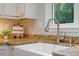 Charming kitchen showcases granite counters, stainless faucet, and an undermount farmhouse sink at 3418 Carriage Trl, Hillsborough, NC 27278