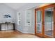 Bright living space featuring hardwood floors, neutral walls, and french doors to outdoor at 3418 Carriage Trl, Hillsborough, NC 27278