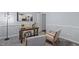 Comfortable office space with desk, chairs, carpet flooring and decorative lighting at 3418 Carriage Trl, Hillsborough, NC 27278