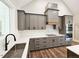 Modern kitchen features gray cabinets, stainless steel appliances, and quartz countertops at 35 Big Bear Dr, Pittsboro, NC 27312