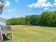 Spacious backyard featuring a wooden fence, perfect for outdoor activities and privacy at 357 Sherrill Farm Dr, Benson, NC 27504