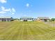 A large, well-maintained backyard extends behind the houses, offering ample space for recreation at 357 Sherrill Farm Dr, Benson, NC 27504