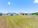 Expansive backyard with a wooden fence, providing privacy and security for outdoor enjoyment at 357 Sherrill Farm Dr, Benson, NC 27504