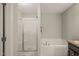 Clean bathroom featuring shower, tub, and neutral colors at 357 Sherrill Farm Dr, Benson, NC 27504