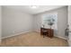 Minimalist bedroom featuring a desk, chair, and natural light at 357 Sherrill Farm Dr, Benson, NC 27504
