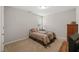 Cozy bedroom featuring a queen-sized bed with a neutral color scheme at 357 Sherrill Farm Dr, Benson, NC 27504