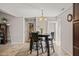 The dining area features a modern chandelier and access to the laundry room at 357 Sherrill Farm Dr, Benson, NC 27504