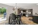 Bright dining area adjacent to kitchen, featuring a table with chairs and sliding glass door to the outdoor space at 357 Sherrill Farm Dr, Benson, NC 27504