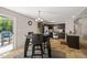 The dining area opens to a kitchen with brown cabinetry and stainless appliances at 357 Sherrill Farm Dr, Benson, NC 27504