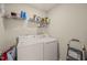Functional laundry room with appliances and shelving for storage at 357 Sherrill Farm Dr, Benson, NC 27504