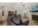 Bright living room showcasing a fireplace, large windows, and comfortable seating for a welcoming and relaxing space at 357 Sherrill Farm Dr, Benson, NC 27504