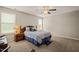This cozy main bedroom features a ceiling fan and lots of natural light at 357 Sherrill Farm Dr, Benson, NC 27504