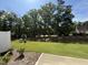 A lush green lawn and tree line create a serene backyard oasis in a beautiful suburban setting at 367 Whitley Ridge Dr, Clayton, NC 27527
