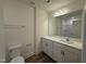 Bathroom with modern vanity, sink, and wood-look tile flooring at 367 Whitley Ridge Dr, Clayton, NC 27527