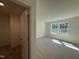 Bright bedroom featuring two windows and neutral carpet at 367 Whitley Ridge Dr, Clayton, NC 27527