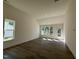 Spacious bonus room featuring hardwood floors and natural light; the perfect flex space at 367 Whitley Ridge Dr, Clayton, NC 27527