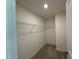 Walk-in closet with white wire shelving and neutral carpet flooring at 367 Whitley Ridge Dr, Clayton, NC 27527