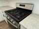Close up of stainless steel oven with quartz countertops and white cabinets at 367 Whitley Ridge Dr, Clayton, NC 27527