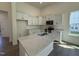 Bright kitchen features white cabinets, a spacious quartz island, and stainless steel appliances at 367 Whitley Ridge Dr, Clayton, NC 27527