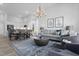 Open-concept living room seamlessly connects to the dining area, creating a welcoming space for entertaining at 367 Whitley Ridge Dr, Clayton, NC 27527