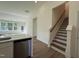 Open-concept floor plan with kitchen island flowing into a living space with many windows at 367 Whitley Ridge Dr, Clayton, NC 27527