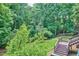 Lush greenery and mature trees provide a private and serene setting at 37 Wedgewood Rd, Chapel Hill, NC 27514