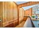 Bar area featuring wood paneling, built-in shelves, and a sleek countertop at 37 Wedgewood Rd, Chapel Hill, NC 27514