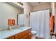 Bathroom featuring a granite countertop vanity, mirror, and a shower and tub combo at 37 Wedgewood Rd, Chapel Hill, NC 27514